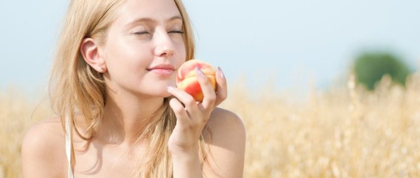 Mindful Eating and Planning – How to Ward off the Dreaded Christmas Weight Gain 12535659 - young happy woman in wheat field with peach. summer picnic
